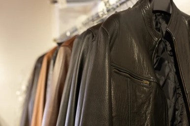 Black Leather Jackets Hanging on Clothing Rack Indoors