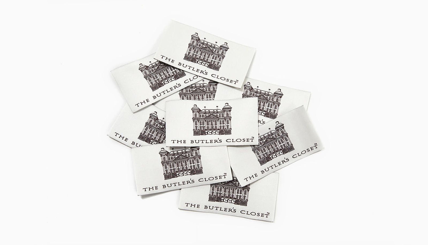 Scattered cards displaying The Butler's Closet and an illustration of a building.