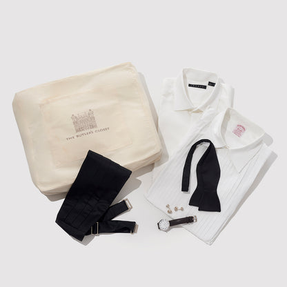 A Cotton Tuxedo Garment Bag With A Tuxedo Folded Beside It